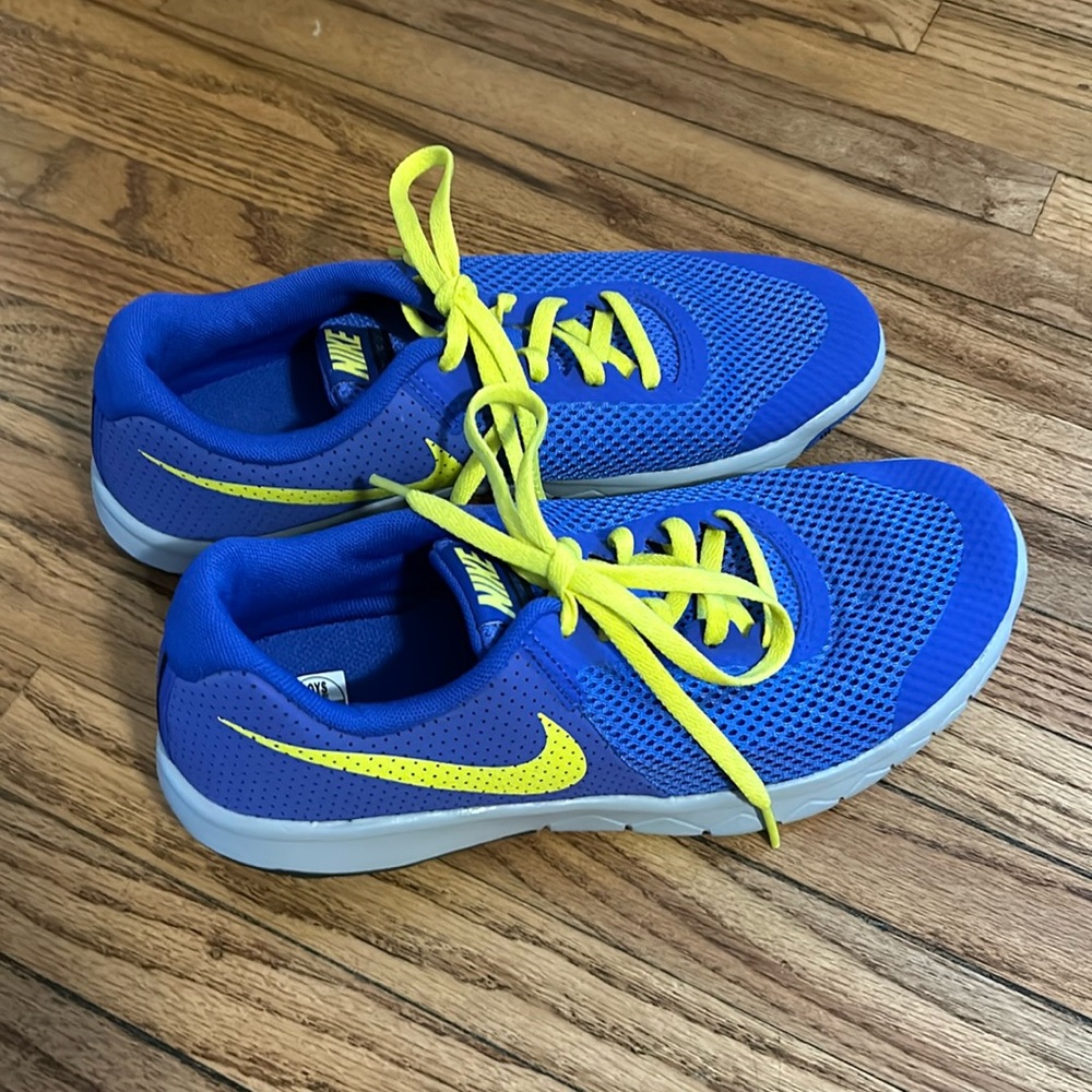Kids blue Nike sneakers with yellow laces, new without tags.